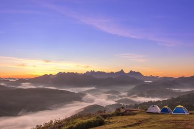 Scenic view of silhouette mountains against sky during sunset