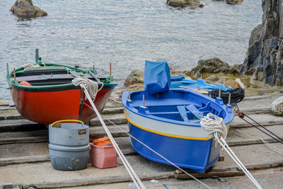 Boats moored on sea shore