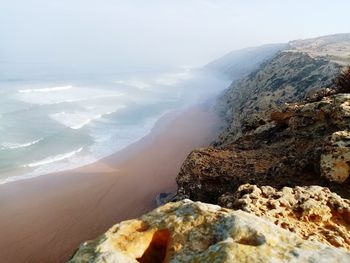 Scenic view of rocks against sky