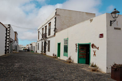 White houses with green doors 