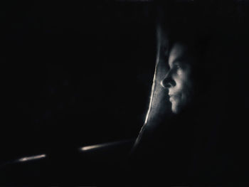 Close-up of man in darkroom