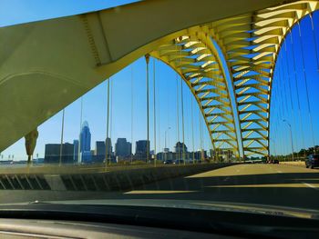 Bridge against sky seen through glass