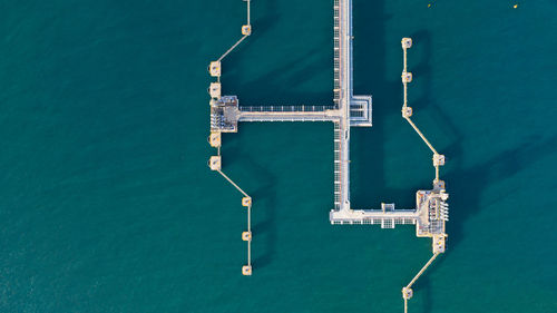 High angle view of commercial dock against blue sea