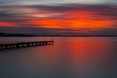 Scenic view of sea against romantic sky at sunset