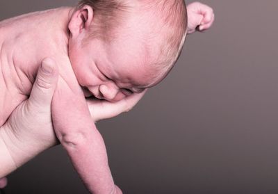 Close-up of hand holding baby