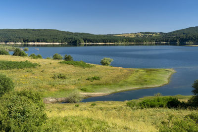 Scenic view of lake against clear sky