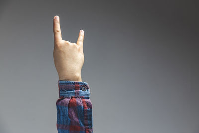 Close-up of person hand against black background