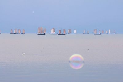 Scenic view of calm sea against clear sky