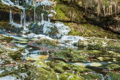 Winter. ice games in the fontanon of goriuda waterfall. friuli, italy.