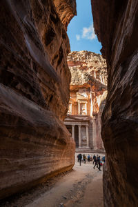 People walking in front of historical building