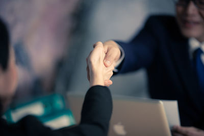 Business people shaking hands in office