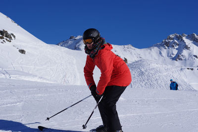 Person standing on snow covered mountain