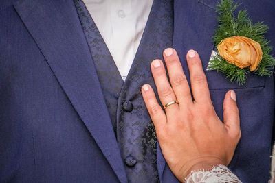 Close-up of hand on chest