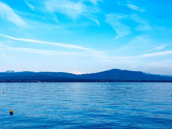 Scenic view of sea against blue sky