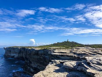 Rock formation on land against sky