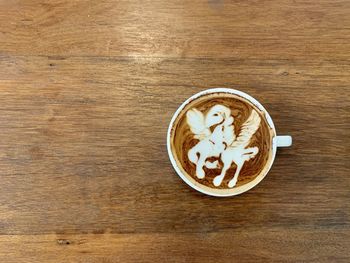 Directly above shot of coffee cup on table