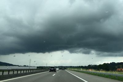 Storm clouds over road