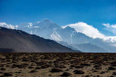 Scenic view of snowcapped mountains against sky