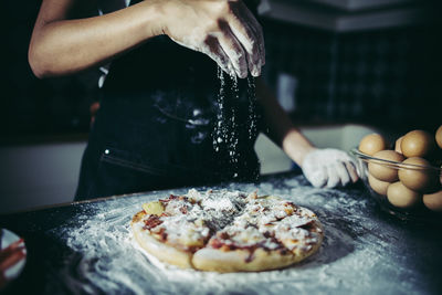 Midsection of person preparing food