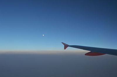 Airplane flying against clear blue sky