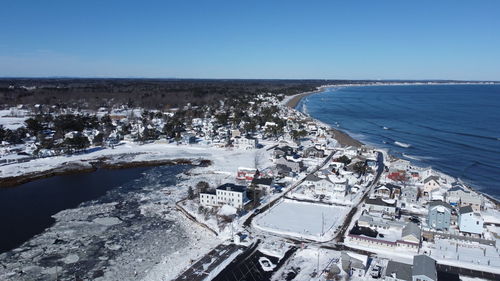 High angle view of sea against clear blue sky