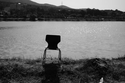Chair on lakeshore