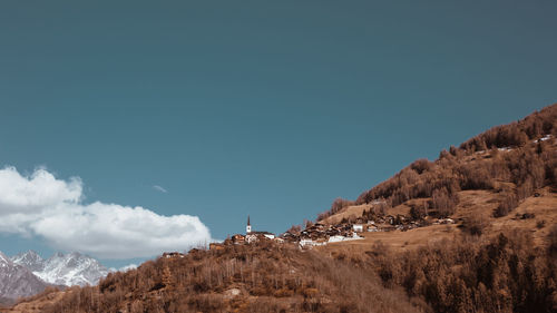 Scenic view of mountains against clear blue sky