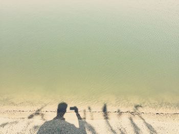 Man against sky seen through curtain