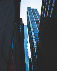 Low angle view of modern buildings against clear sky