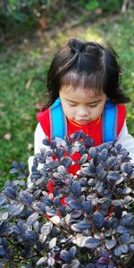 Portrait of cute girl with plants