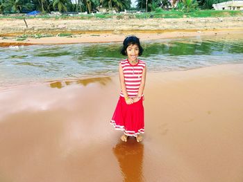 Portrait of girl standing on beach