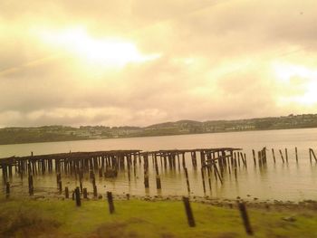 Scenic view of landscape against cloudy sky