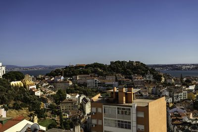 Townscape by sea against clear sky lisbon portugal 