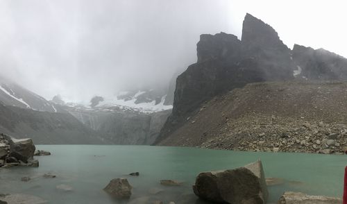 Scenic view of lake and mountains against sky