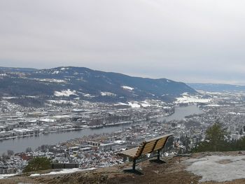 Aerial view of snowcapped mountains against sky