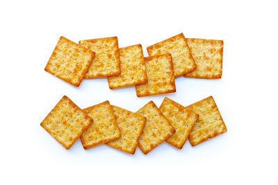 High angle view of bread in plate against white background