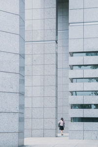 Side view of a man standing on staircase