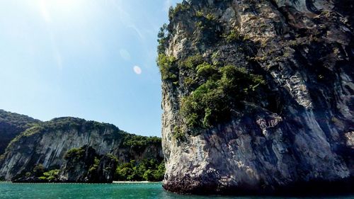 Scenic view of sea and mountains against sky
