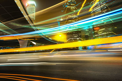 Light trails on road in city at night