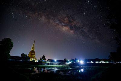 Illuminated building against sky at night