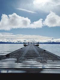 Pier over sea against sky