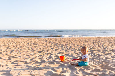 Baby playing on beach