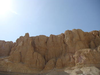 Rock formations on landscape against clear sky