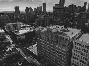 High angle view of buildings in city against sky