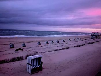 Scenic view of beach against sky during sunset