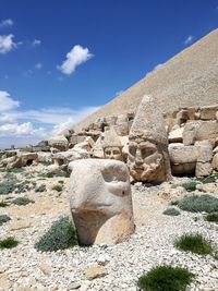 Low angle view of rock formation against sky