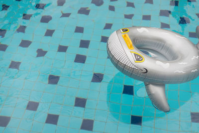 High angle view of inflatable ring floating on swimming pool