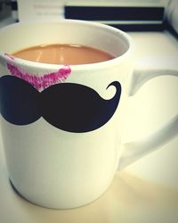 Close-up of coffee cup on table