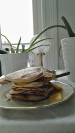 Close-up of bread in plate on table