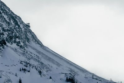 Scenic view of snow covered mountain against sky